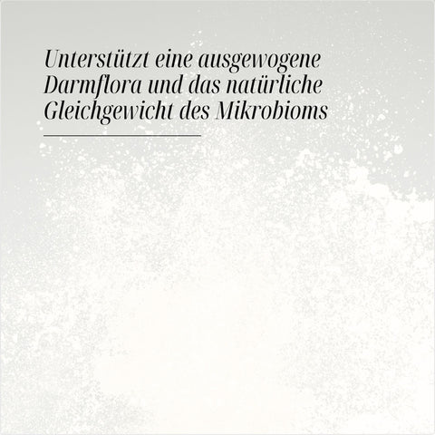 Hintergrund mit weißem Pulver und Text „Unterstützt eine ausgewogene Darmflora und das natürliche Gleichgewicht des Mikrobioms“.